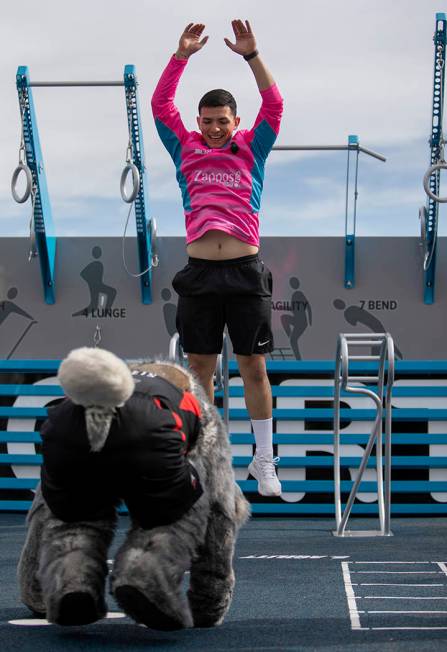 Las Vegas Lights goalkeeper Angel Alvarez does burpees with the Las Vegas Aces mascot at the ne ...