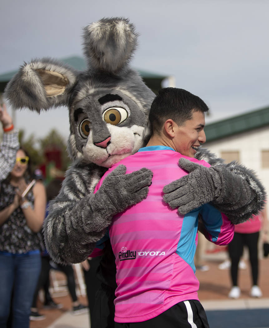 Las Vegas Lights goalkeeper Angel Alvarez gives the Las Vegas Aces mascot a post-workout hug at ...