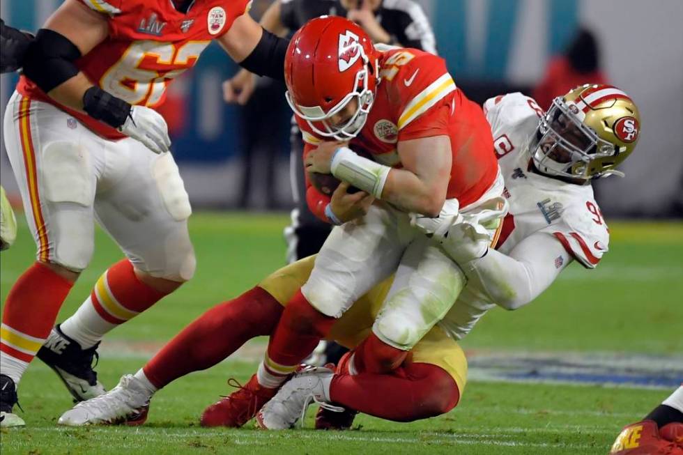 San Francisco 49ers' DeForest Buckner, right, sacks Kansas City Chiefs' quarterback Patrick Mah ...