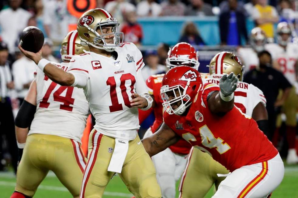 San Francisco 49ers' DeForest Buckner, right, sacks Kansas City Chiefs' quarterback Patrick Mah ...