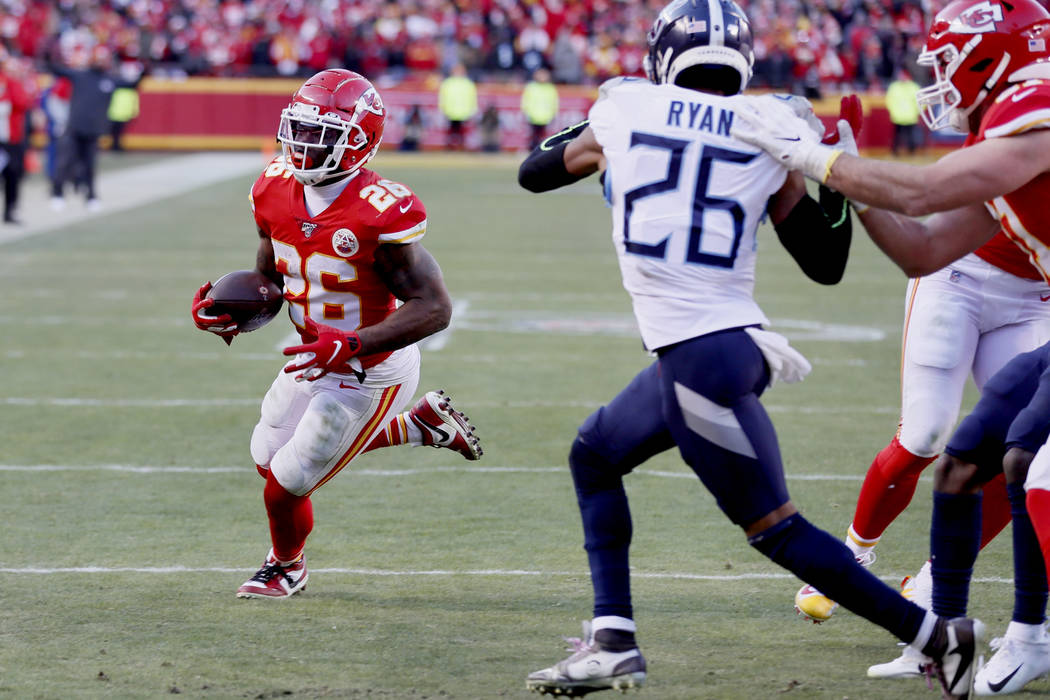Kansas City Chiefs' Damien Williams runs for a touchdown past Tennessee Titans cornerback Logan ...