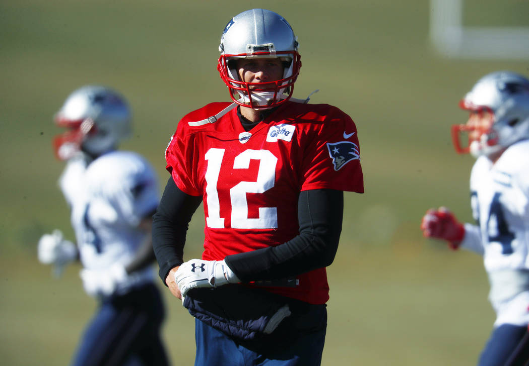 New England Patriots quarterback Tom Brady takes part in drills before practicing Wednesday, No ...