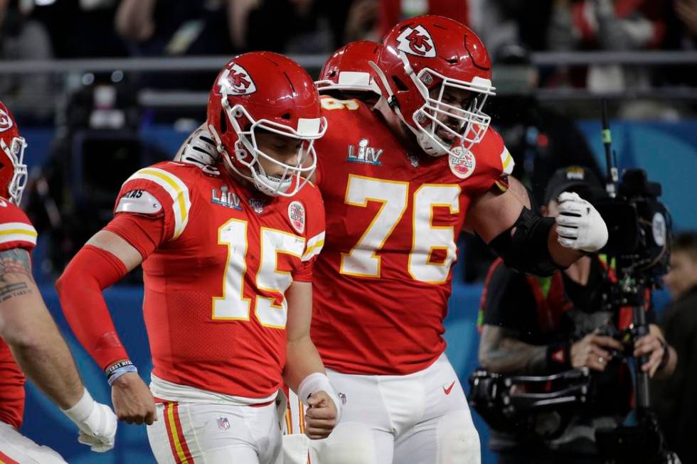 Kansas City Chiefs quarterback Patrick Mahomes (15) celebrates his touchdown with Kansas City C ...