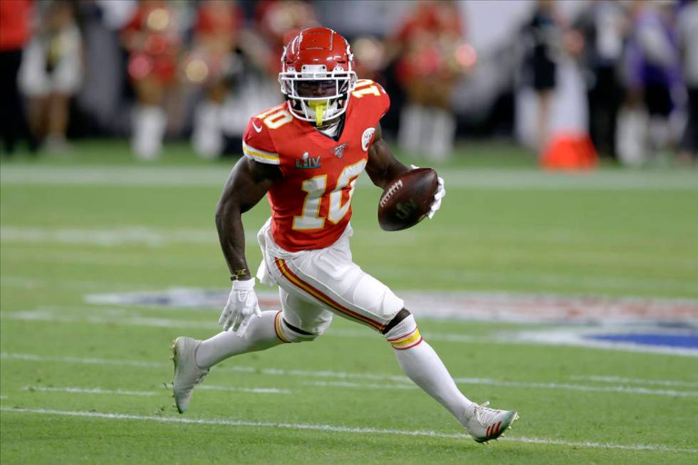 Kansas City Chiefs' Tyreek Hill runs against the San Francisco 49ers during the first half of t ...