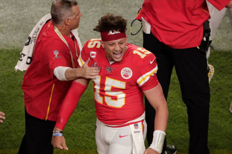 Kansas City Chiefs quarterback Patrick Mahomes (15) reacts after scoring a touchdown, during th ...