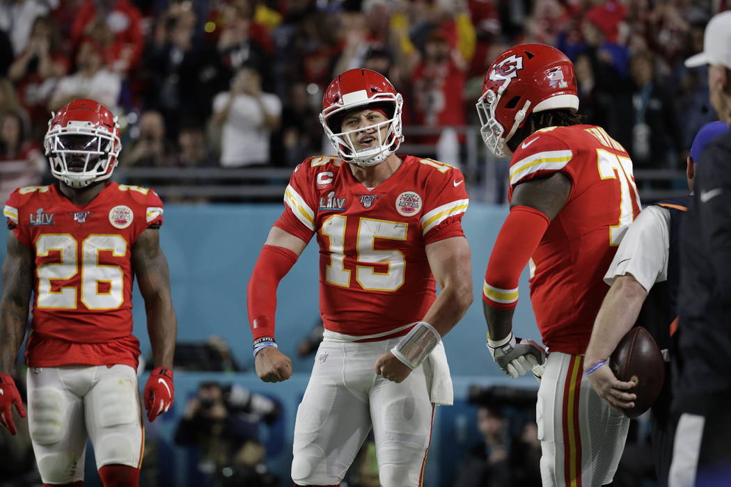 Kansas City Chiefs quarterback Patrick Mahomes (15) celebrates his touchdown the San Francisco ...