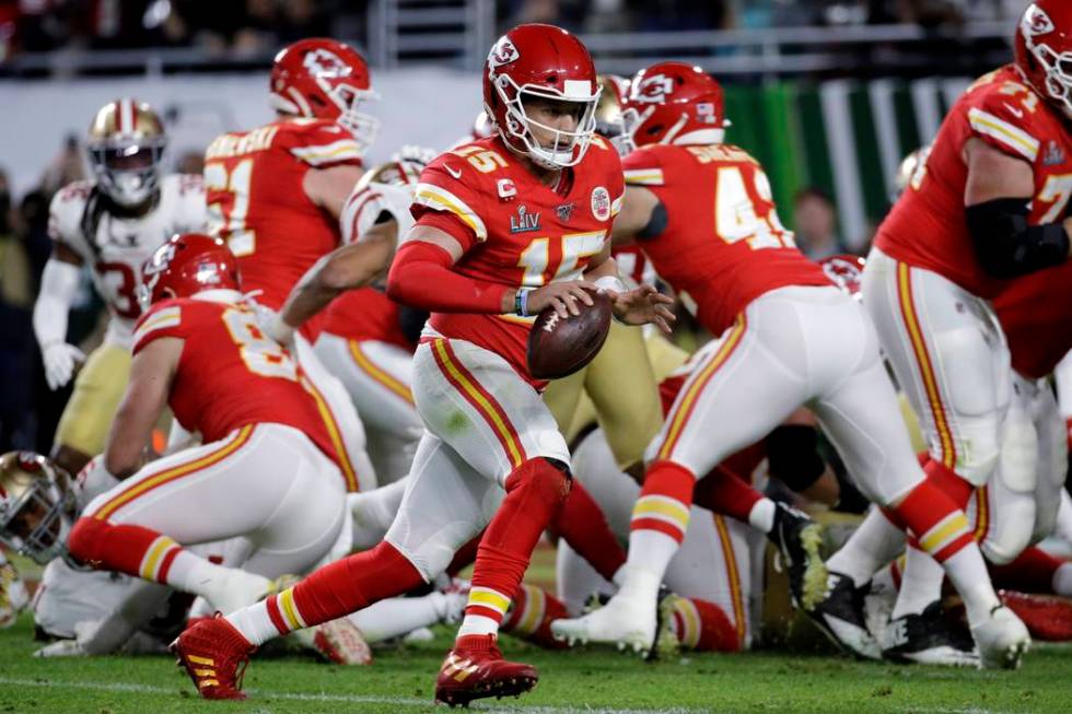 Kansas City Chiefs quarterback Patrick Mahomes (15) runs for a touchdown against the San Franci ...