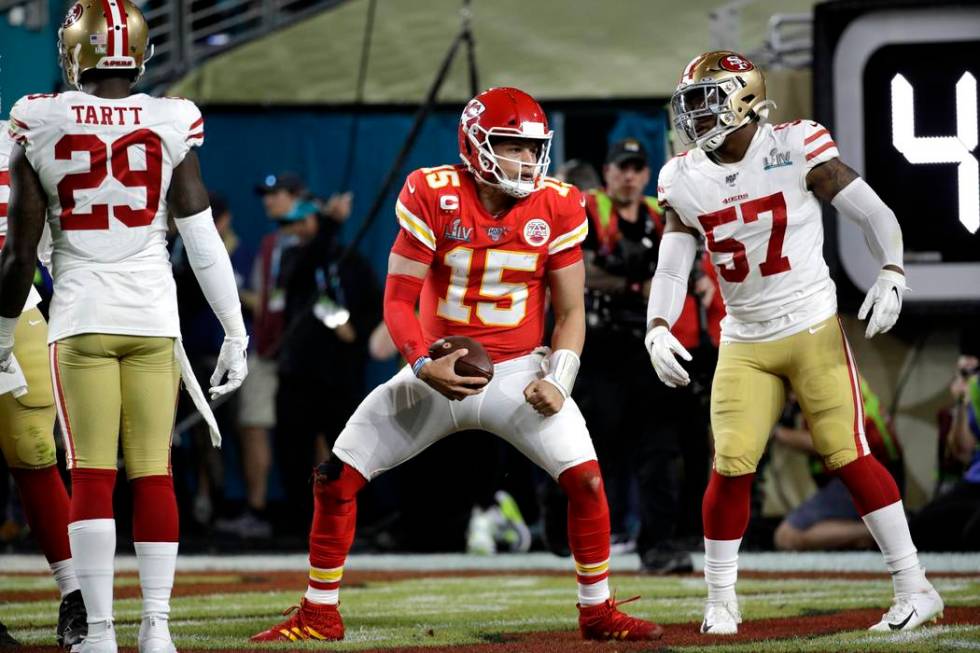 Kansas City Chiefs quarterback Patrick Mahomes (15) celebrates after scoring against the San Fr ...