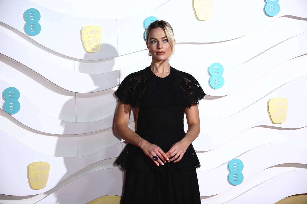 Margot Robbie poses for photographers upon arrival at the Bafta Film Awards, in central London, ...