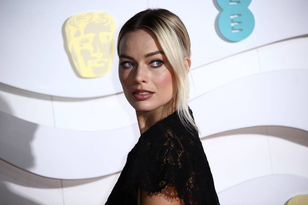 Margot Robbie poses for photographers upon arrival at the Bafta Film Awards, in central London, ...