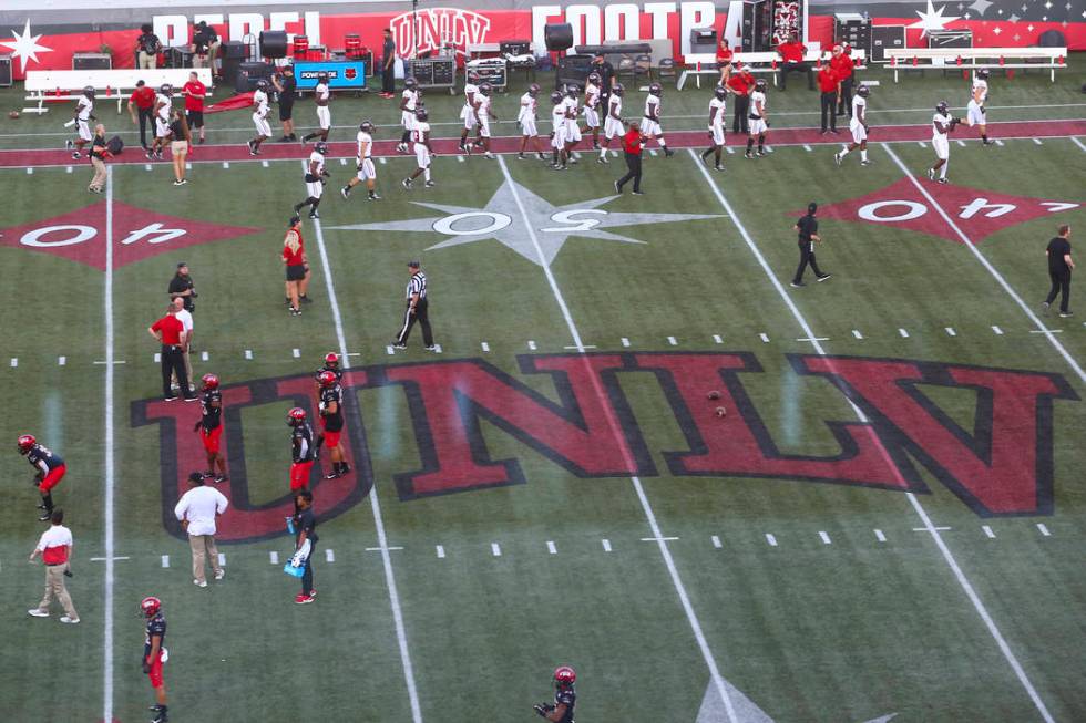 UNLV football players warm up before taking on Arkansas State in an NCAA football game at Sam B ...