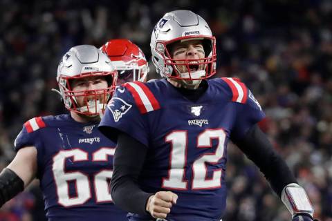 New England Patriots quarterback Tom Brady reacts after running for yardage in the fourth quart ...
