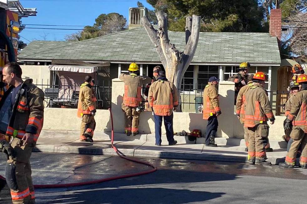 Firefighters work the scene of a house fire at 1220 S.10th St. that displaced one resident Tues ...