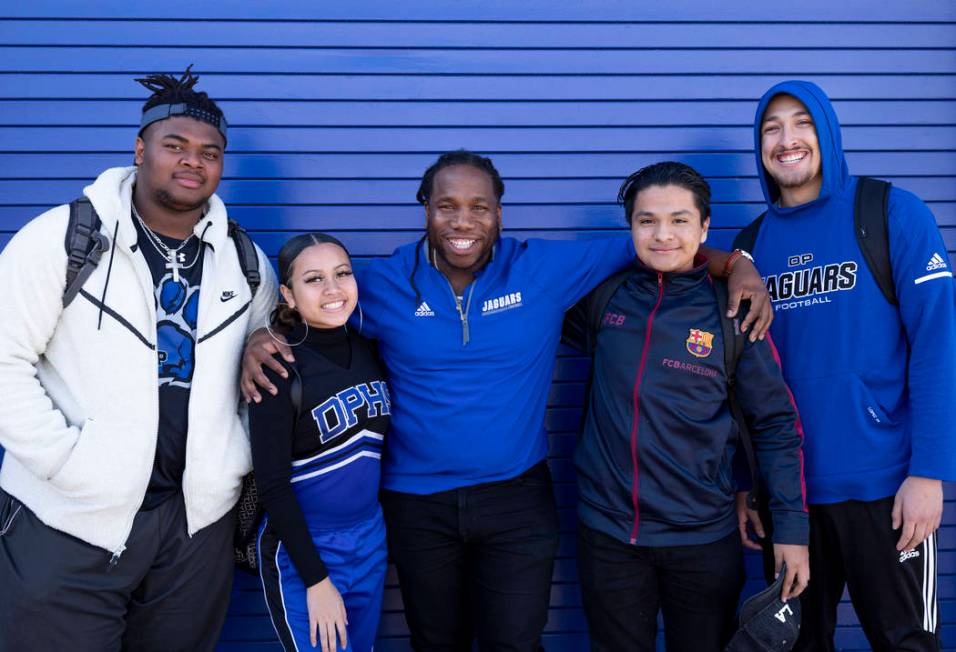 Assistant football coach and Life Skills teacher David Hill, center, with his students from lef ...