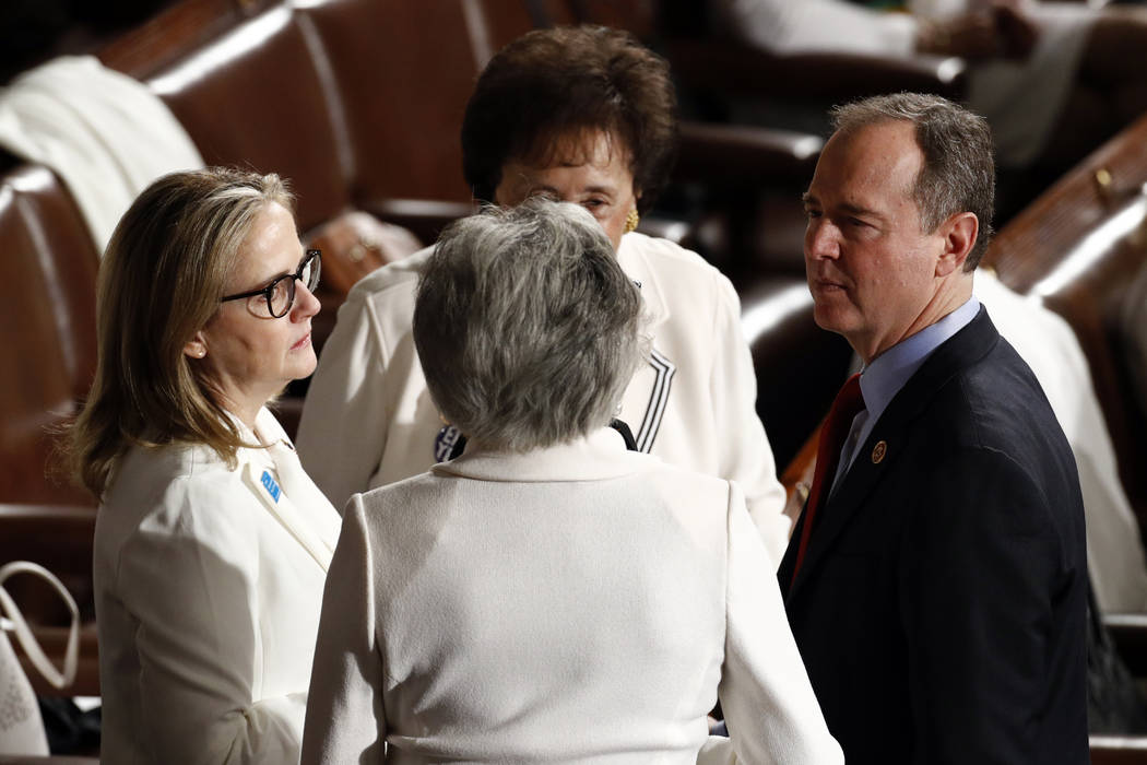 Rep. Adam Schiff, D-Calif., right, talks to Rep. Madeleine Dean, D-Pa., left, before President ...