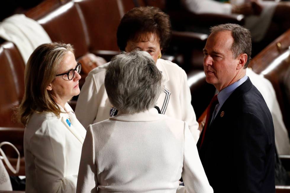 Rep. Adam Schiff, D-Calif., right, talks to Rep. Madeleine Dean, D-Pa., left, before President ...