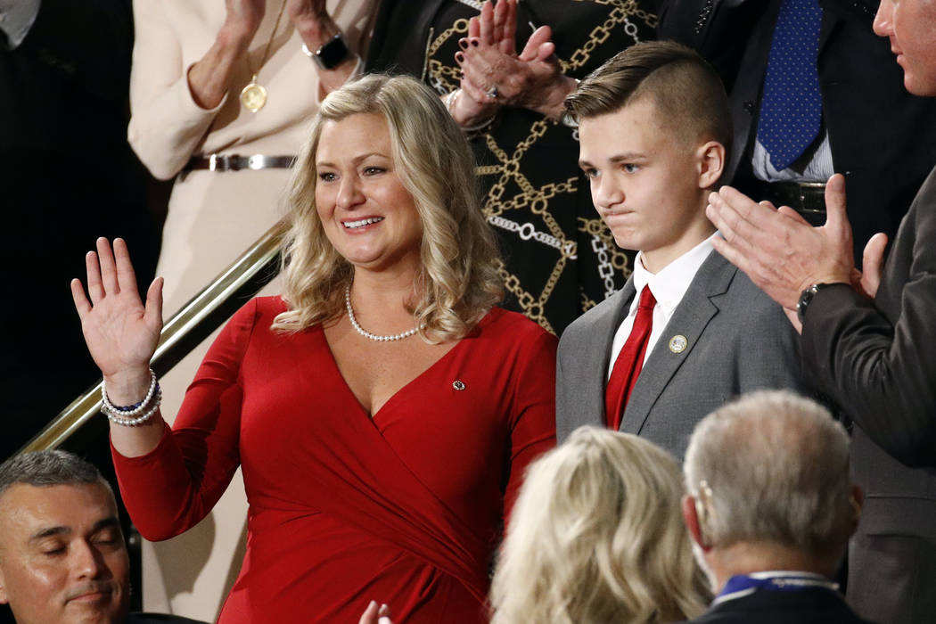 Kelli and Gage Hake of Stillwater, Okla., are recognized by President Donald Trump during his S ...