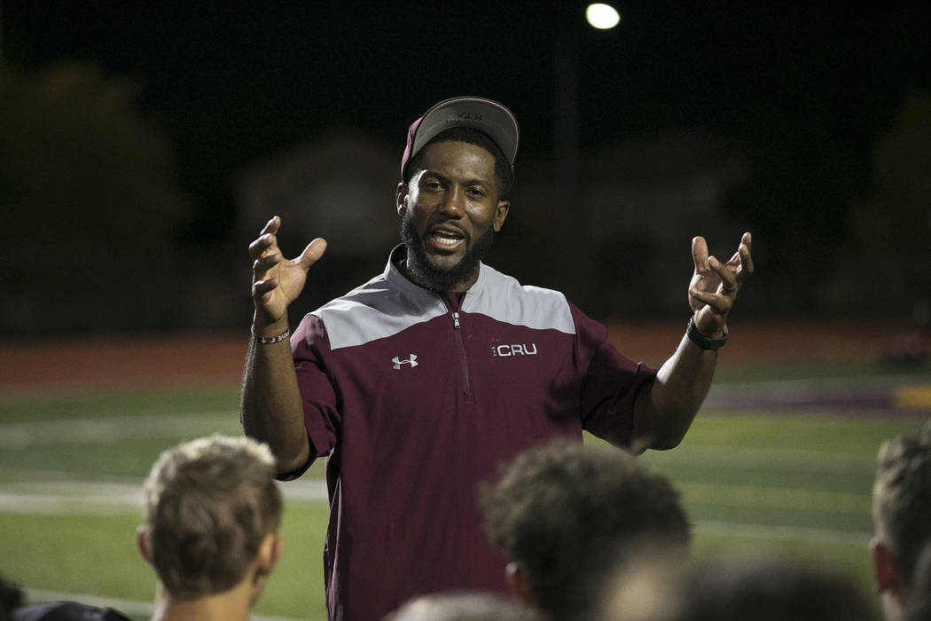 Faith Lutheran football coach Vernon Fox III talks to his team after their loss to Valor Christ ...