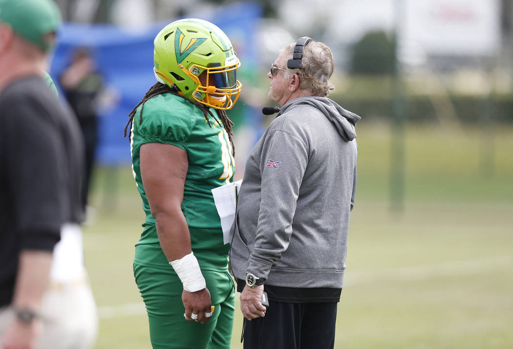 Tampa Bay Vipers defensive tackle Nikita Whitlock (49) talks with defensive coordinator Jerry G ...