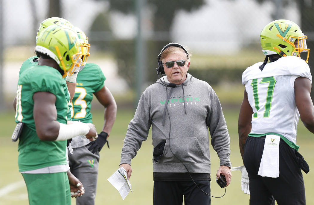 Tampa Bay Vipers defensive coordinator Jerry Glanville talks with his players during practice a ...