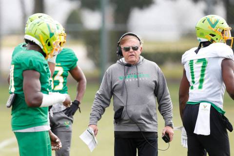 Tampa Bay Vipers defensive coordinator Jerry Glanville talks with his players during practice a ...