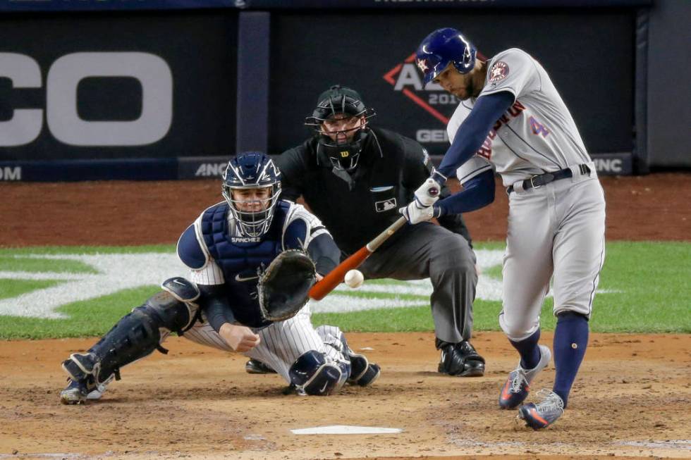 Houston Astros' George Springer (4) connects for a three-run home run against the New York Yank ...