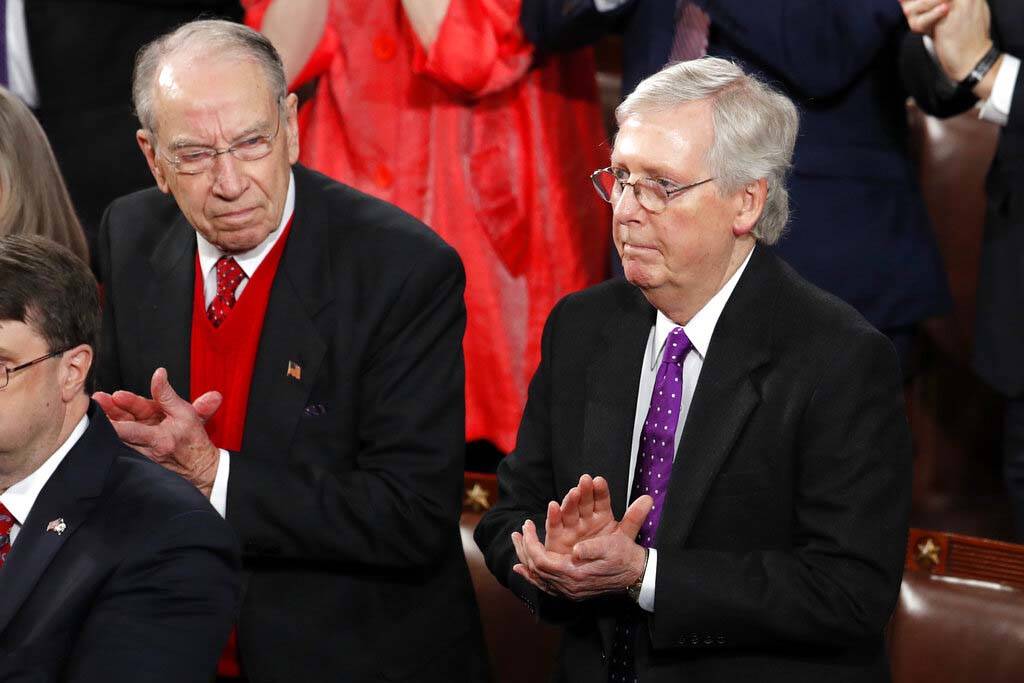 Sen. Chuck Grassley, R-Iowa, left, and Senate Majority Leader Mitch McConnell, R-Ky., listen as ...