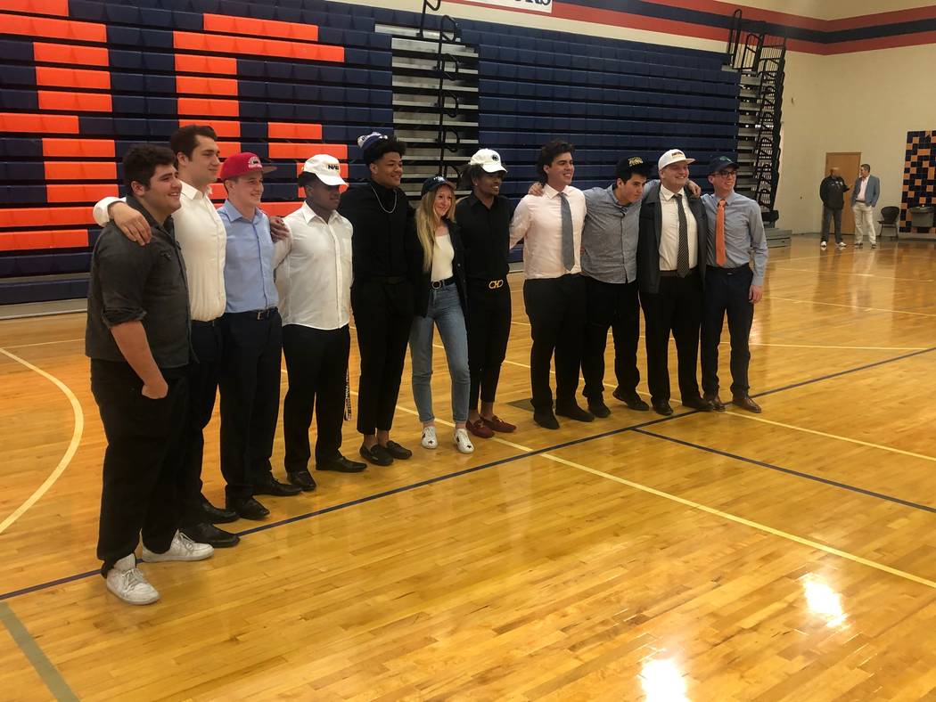 Bishop Gorman athletes pose for a photo after signing their letters of intent on national signi ...