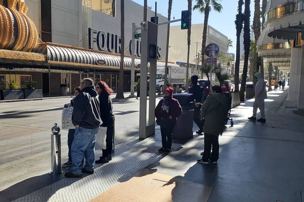 Folks trying to deal with the temperature drop Tuesday, Feb. 4, 2020, at the Fremont Street Exp ...