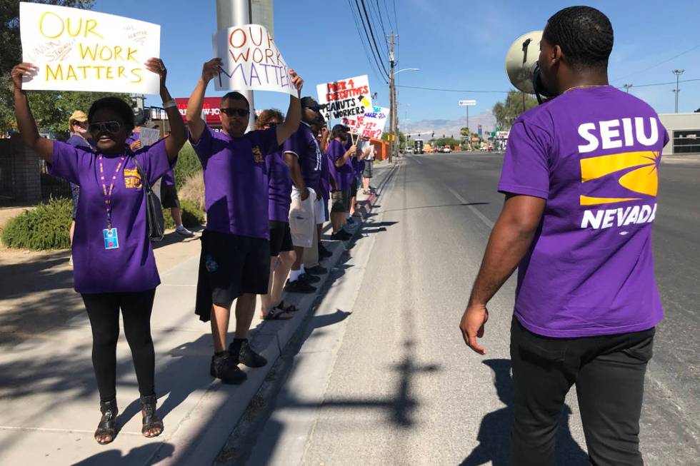 William McCurdy, right, political director of the Service Employees International Union, leads ...