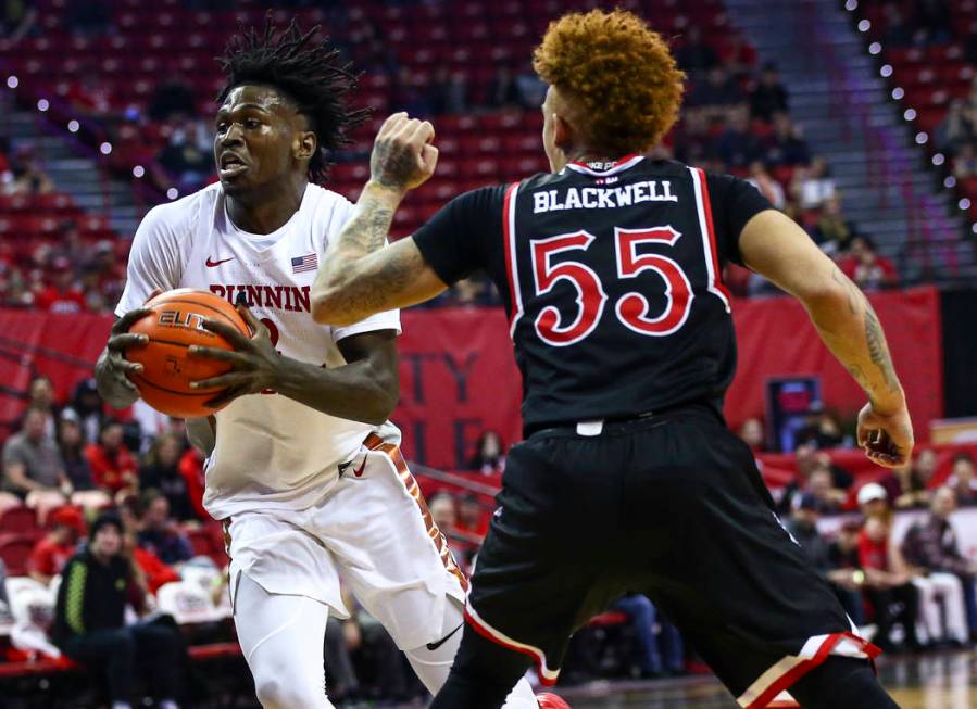 UNLV's Donnie Tillman (2) drives to the basket against Fresno State's Noah Blackwell (55) durin ...