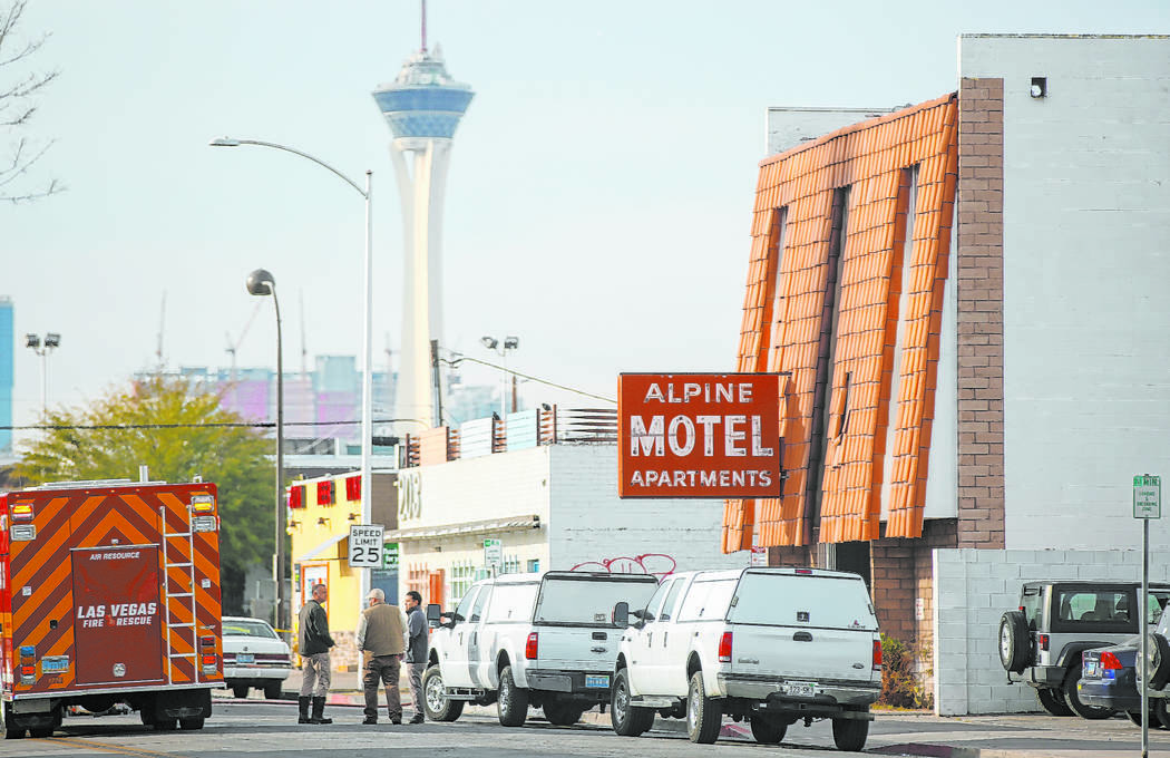 Las Vegas firefighters respond to the scene of a fire at the Alpine Motel Apartments that left ...
