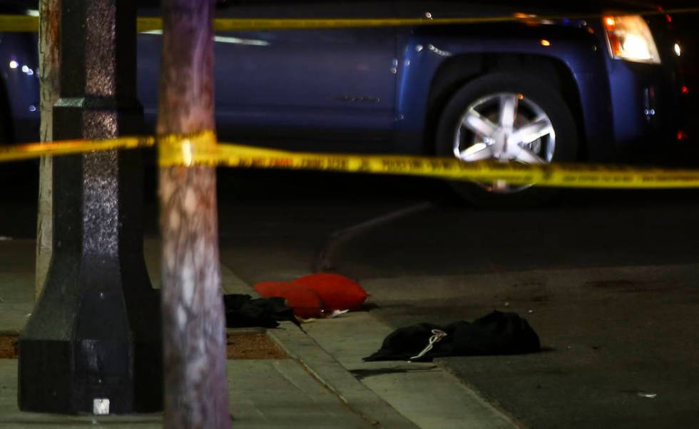 Clothes and other items on the ground at the scene of a shooting on Fremont Street between 14th ...