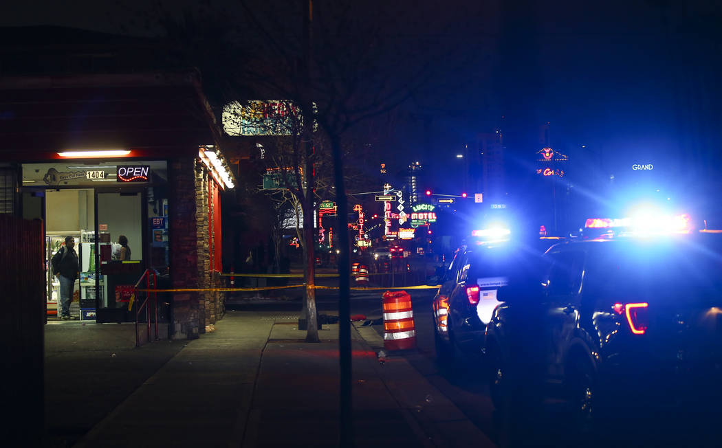 Las Vegas police officers investigate the scene of a shooting on Fremont Street between 14th an ...