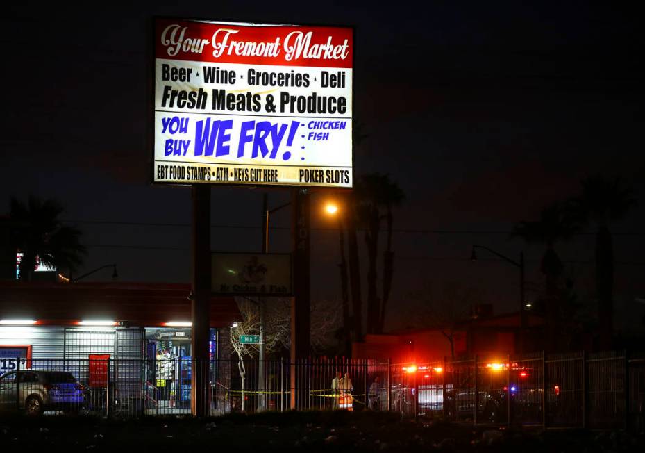 Las Vegas police officers investigate the scene of a shooting on Fremont Street between 14th an ...