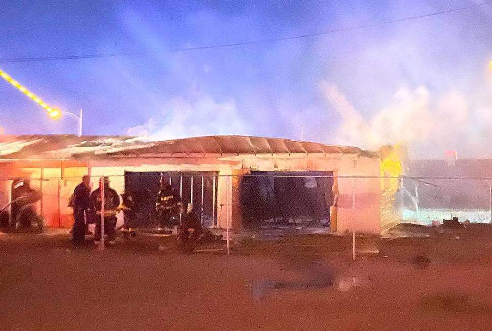 North Las Vegas firefighters battle a blaze at 2511 McCarran St. about 5 a.m. Friday, Feb. 7, 2 ...