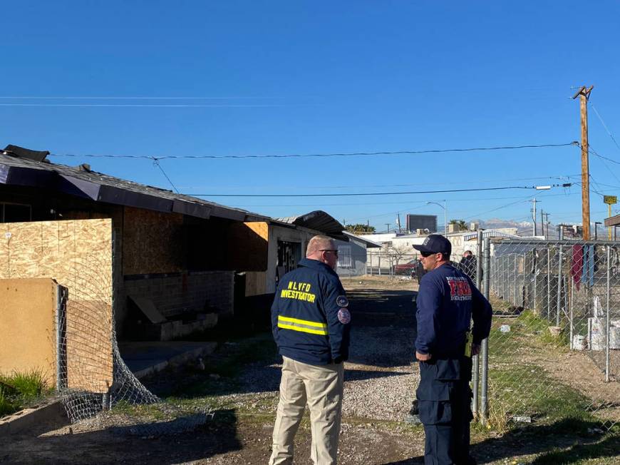 North Las Vegas police and fire inspectors investigate a fatal fire on Friday, Feb. 7, 2020, at ...