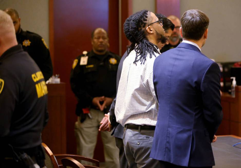 Ray Charles Brown reacts to a verdict of life with the possibility of parole while flanked by a ...