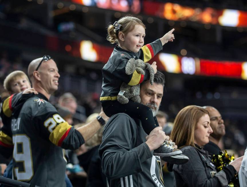 Goldens Knights fans cheer for Vegas before the start of their NHL hockey game with the Carolin ...