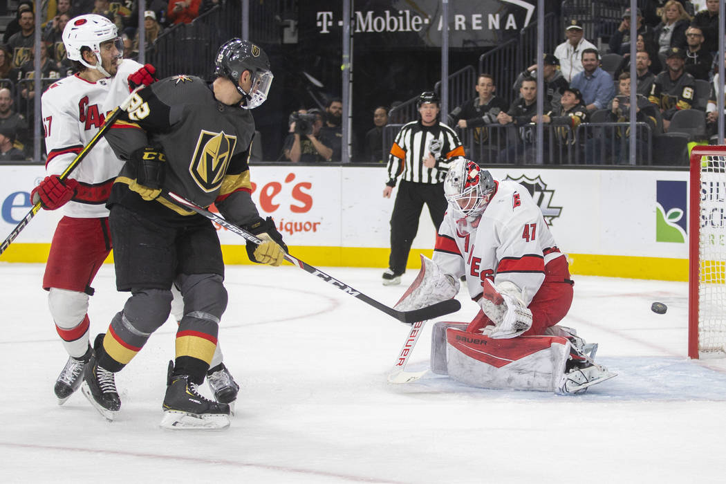 Vegas Golden Knights left wing Tomas Nosek (92) shoots on Carolina Hurricanes goaltender James ...