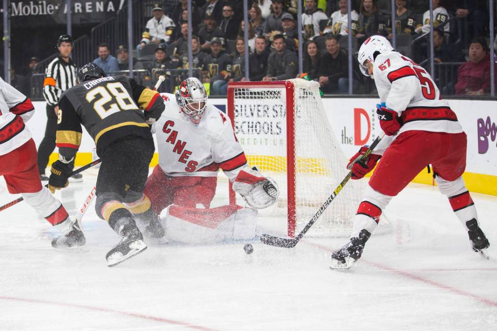 Vegas Golden Knights left wing William Carrier (28) shoots on Carolina Hurricanes goaltender Ja ...