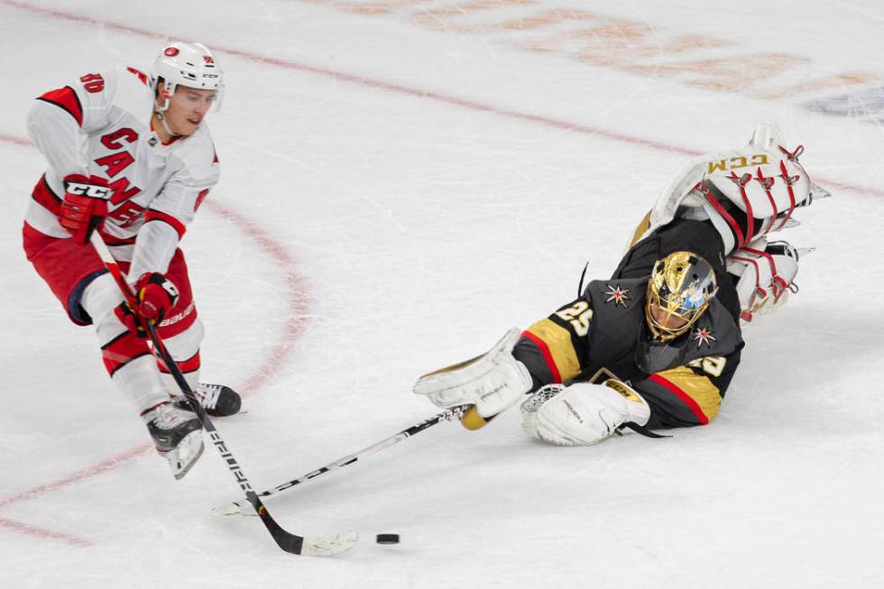 Vegas Golden Knights goaltender Marc-Andre Fleury (29) makes a diving poke save against Carolin ...