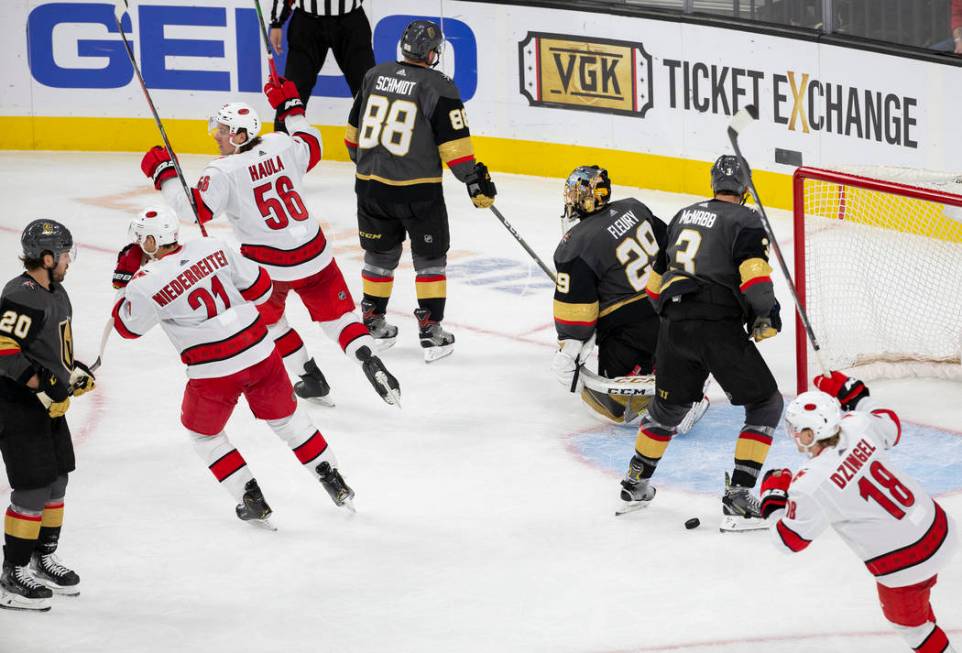 Carolina Hurricanes left wing Erik Haula (56) celebrates with Carolina Hurricanes right wing Ni ...