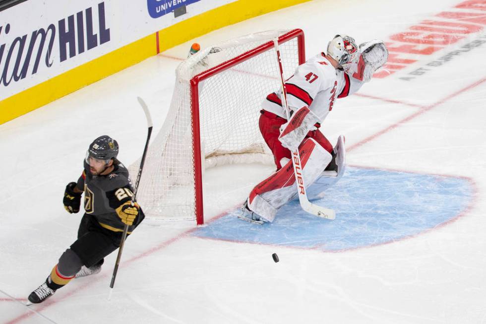 Vegas Golden Knights center Chandler Stephenson (20) scores a third period goal against Carolin ...