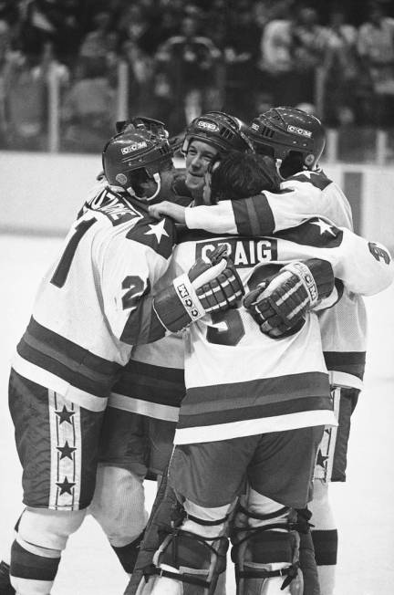 FILE-In this Feb. 22, 1980 file photo, Michael Eruzione, left, scorer of the decisive fourth go ...