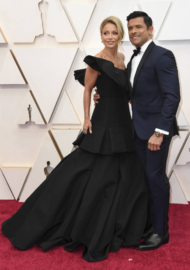 Kelly Ripa, left, and Mark Consuelos arrive at the Oscars on Sunday, Feb. 9, 2020, at the Dolby ...