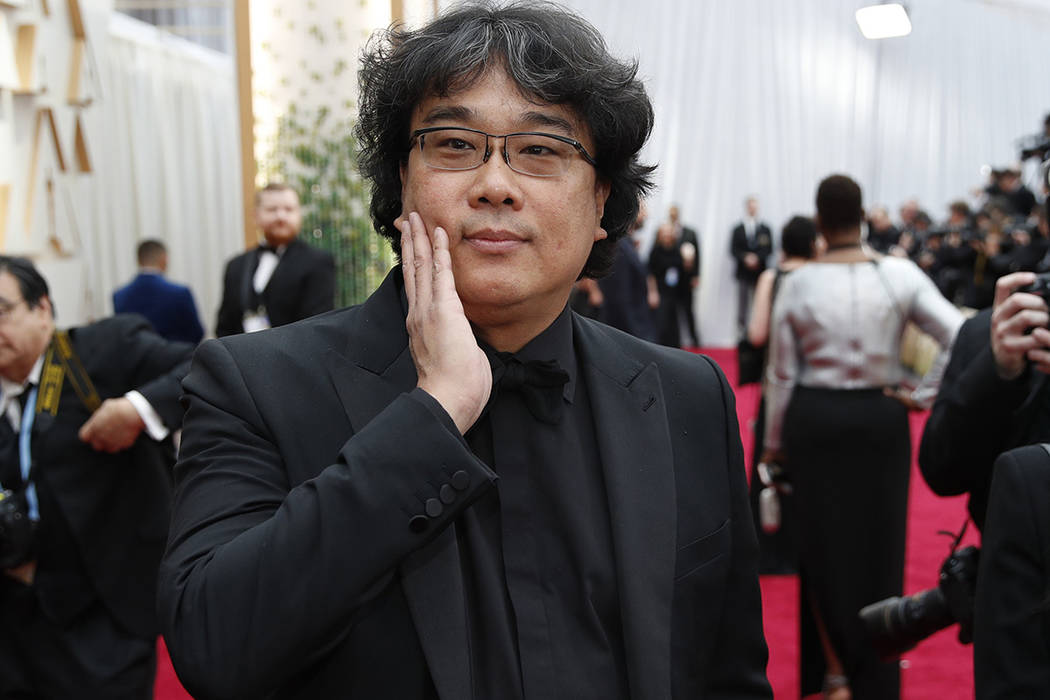 Bong Joon-ho arrives at the Oscars on Sunday, Feb. 9, 2020, at the Dolby Theatre in Los Angeles ...