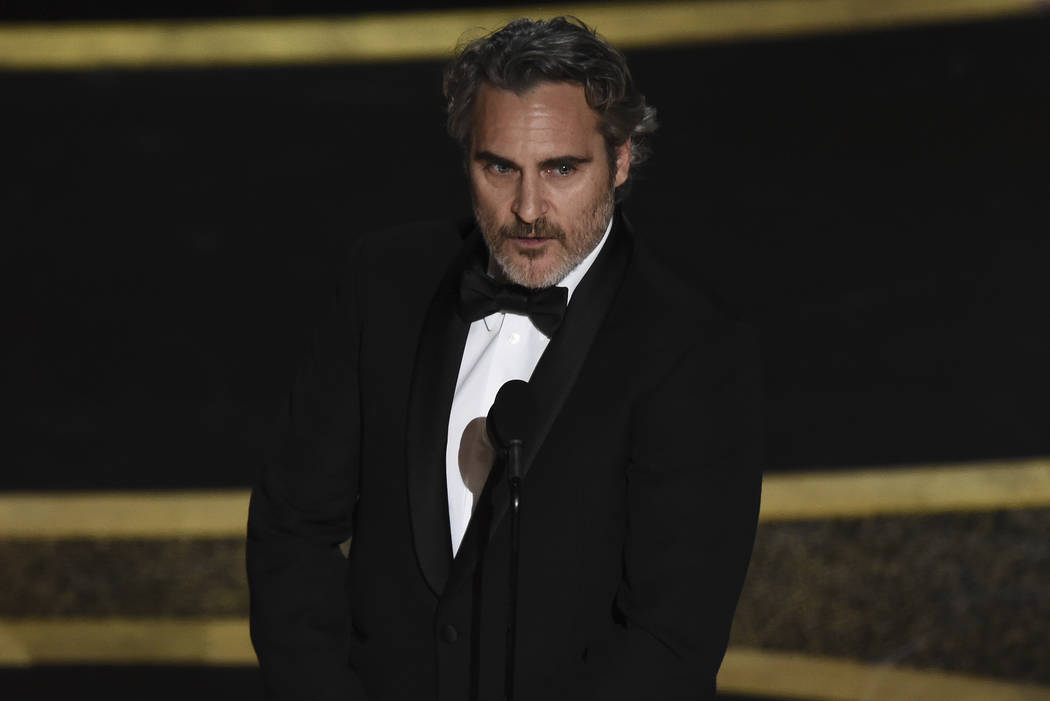 Joaquin Phoenix accepts the award for best performance by an actor in a leading role for " ...