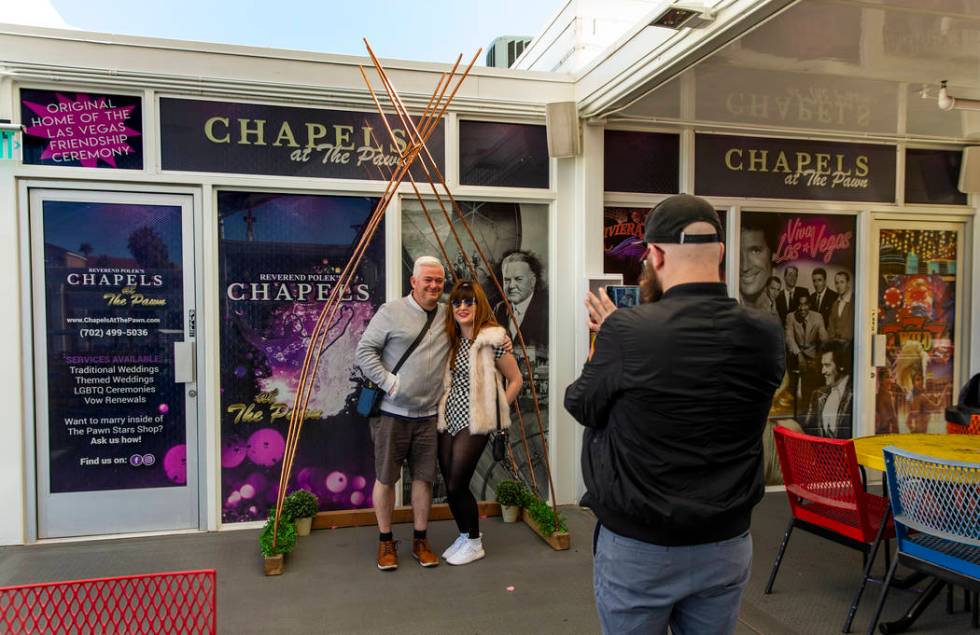 Patrick Conlin, left, stands with Sophie Prydderch under and arch as Lumston, all of Whales, ta ...