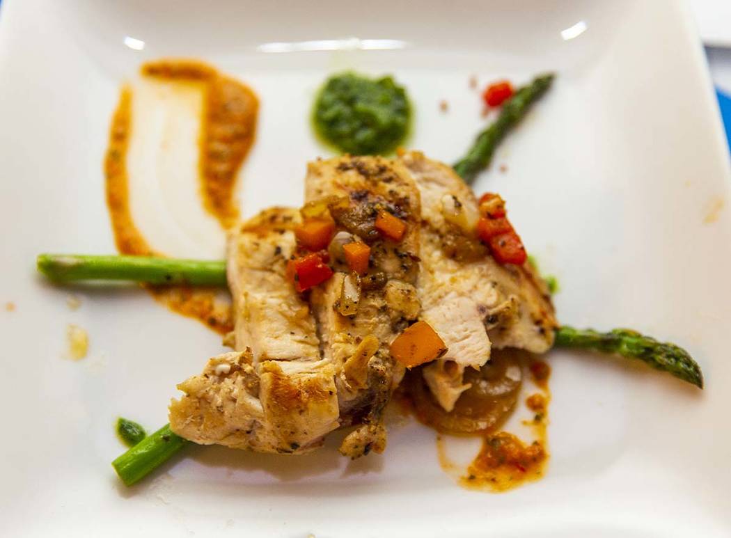 A chicken breast with romensco sauce dish by Chef LaDonna Bell, Chef Battle Quad Cities winner, ...